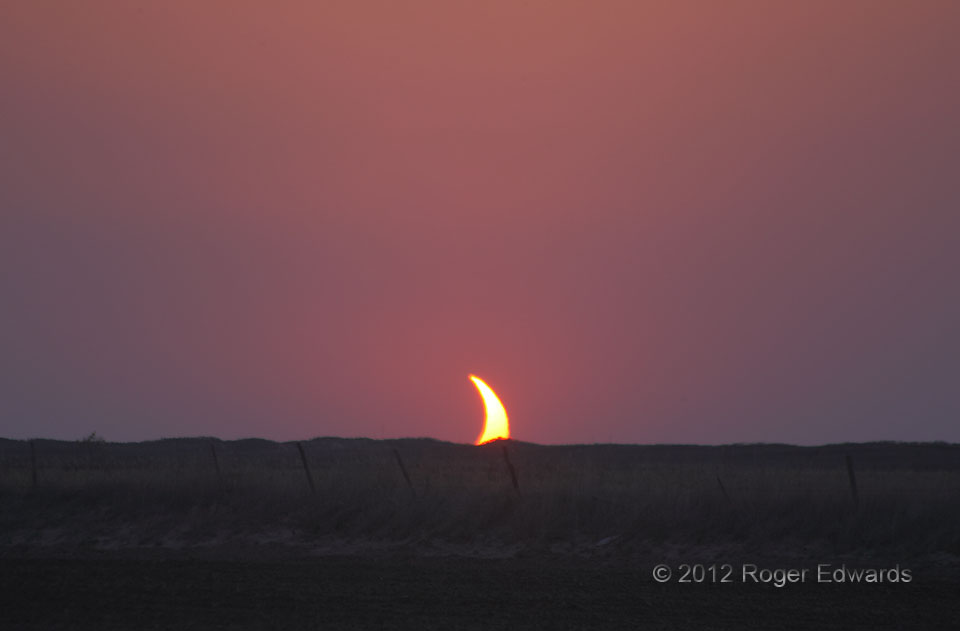 Shark's Fin formation in sunset solar eclipse