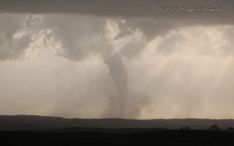 Sunlit Tornadic Finale through Rain