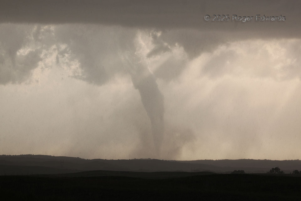 Sunlit Tornadic Finale through Rain